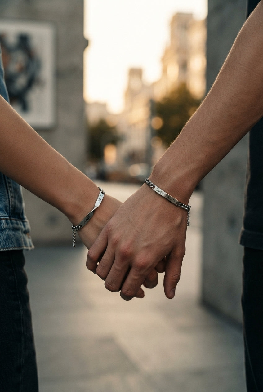 A couple wearing matching Mobius strip bracelets on their wrists, symbolizing eternal connection in a sophisticated, minimali